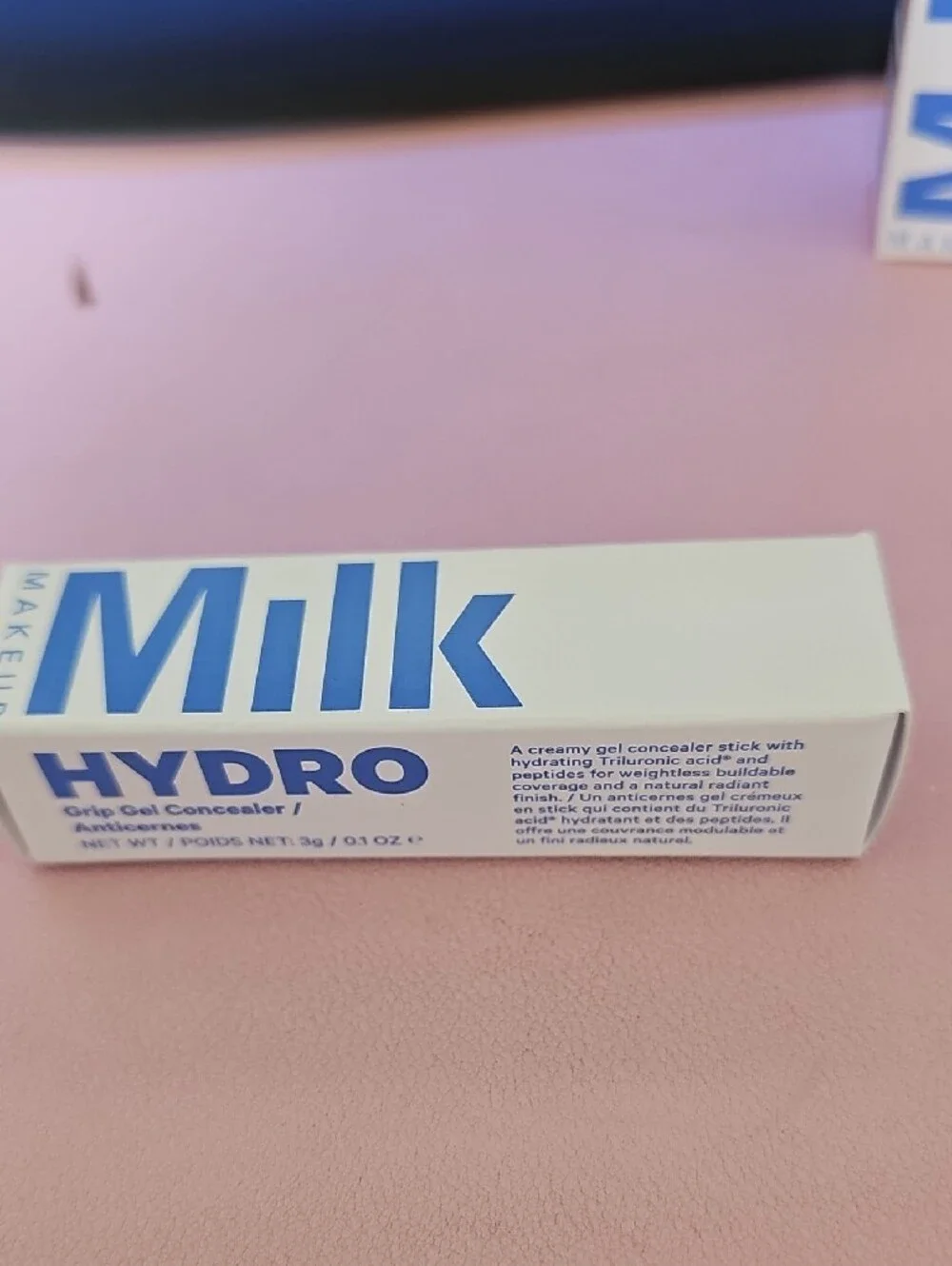 Milk Makeup White Packaging with Bold Blue Logo